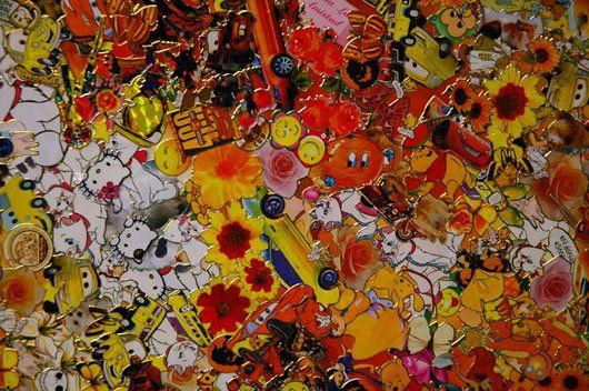 A close up of a colorful collage of cartoon characters and flowers.
