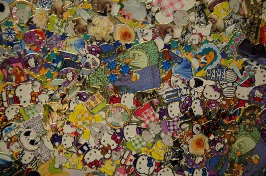 A bunch of stuffed animals are sitting on top of each other on a table.