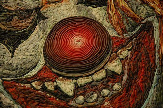 A close up of a painting with a red circle in the middle.