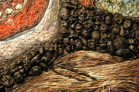 A close up of a painting of skulls on a wall.