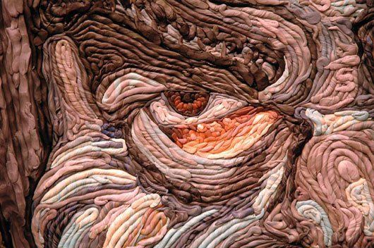 A close up of a painting of a person 's face.