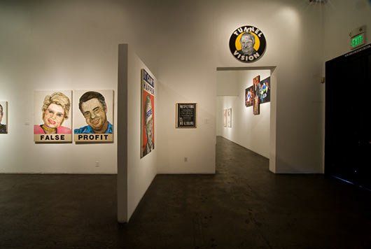 A hallway with a sign on the wall that says comedy studio