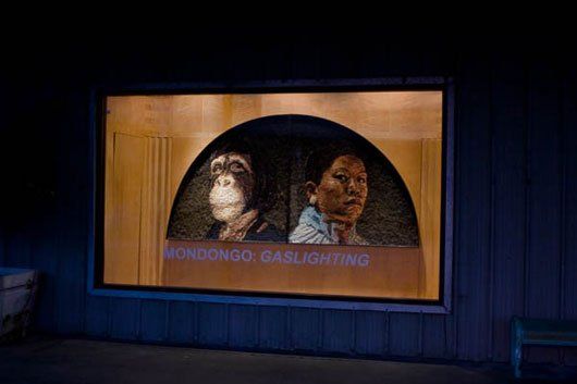 There is a painting of a man and a woman in a window.