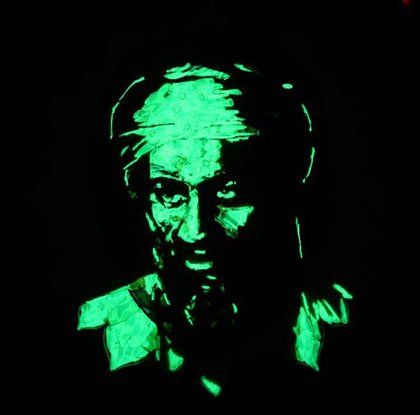 A glow in the dark drawing of a man 's face