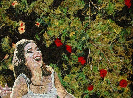 A painting of a woman laughing in front of a tree with red flowers.