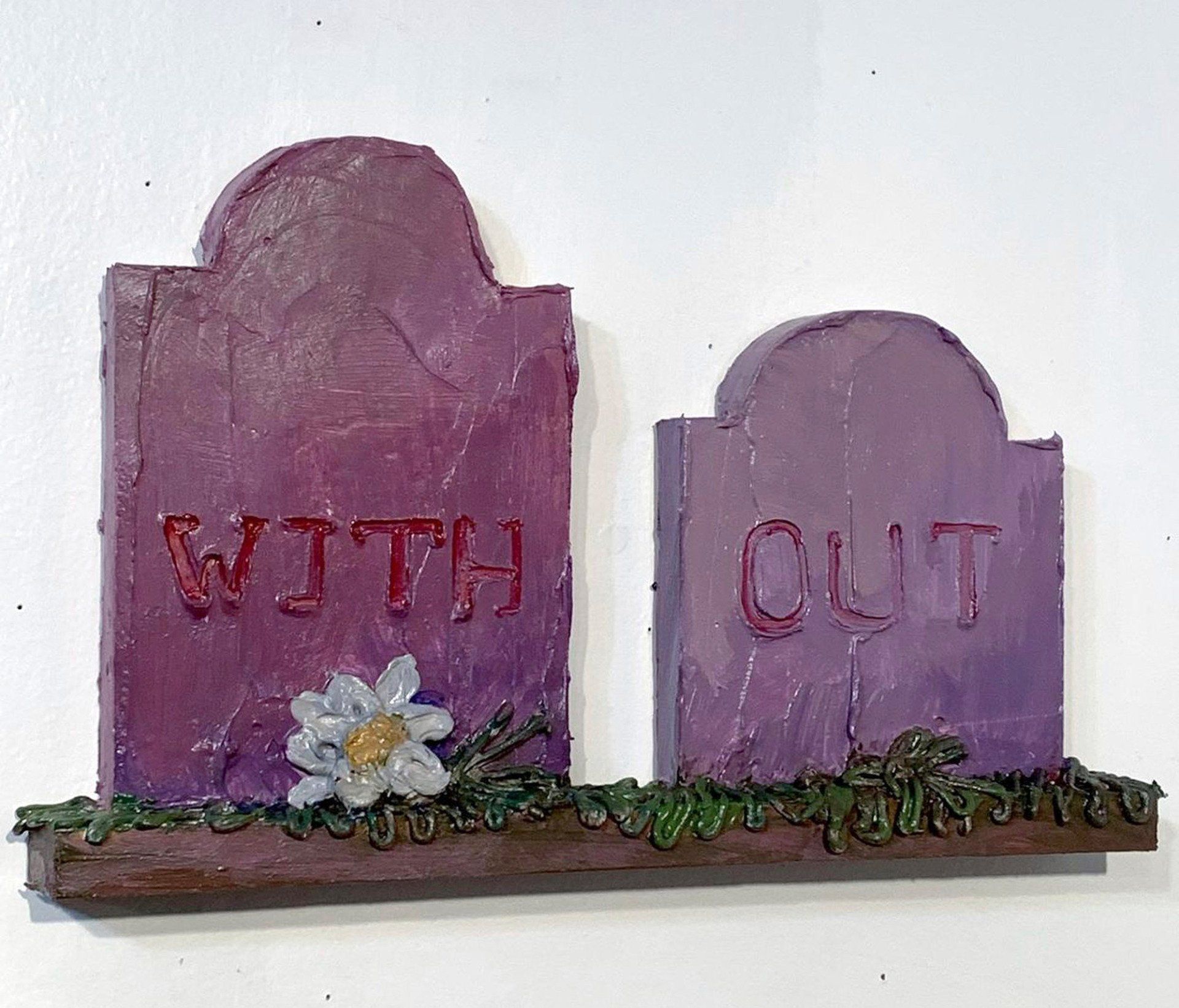 A purple tombstone with the words with out written on it