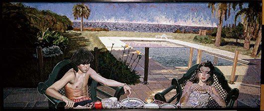 A man and a woman are sitting in chairs in front of a swimming pool.