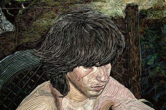 A close up of a painting of a man with long hair.