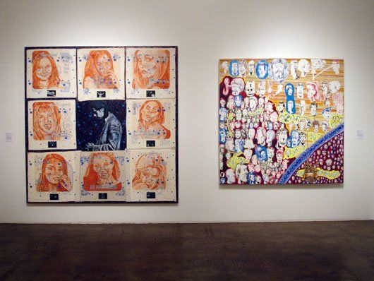Two paintings are hanging on a wall in a museum.