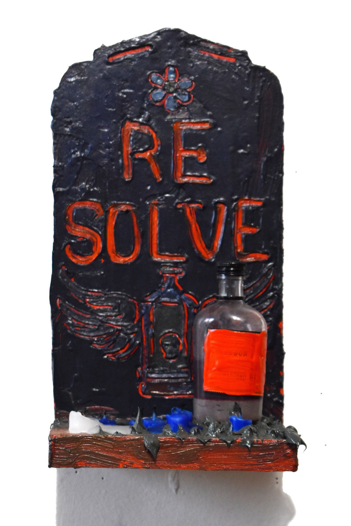 A gravestone with the words re solve written on it