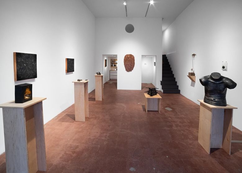 Painting of a woman with five eyes blending with an image of a ballroom.