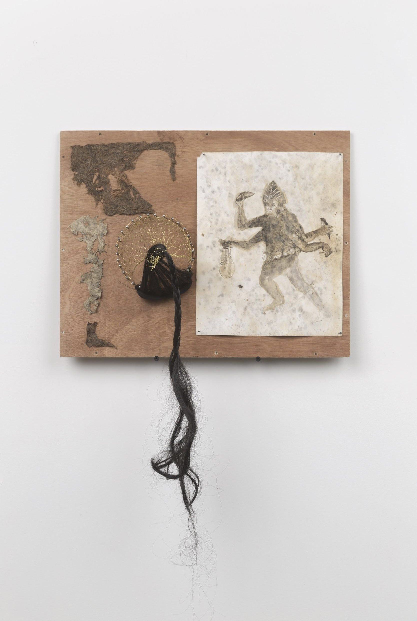 A painting of a man holding a hammer is hanging on a wall.