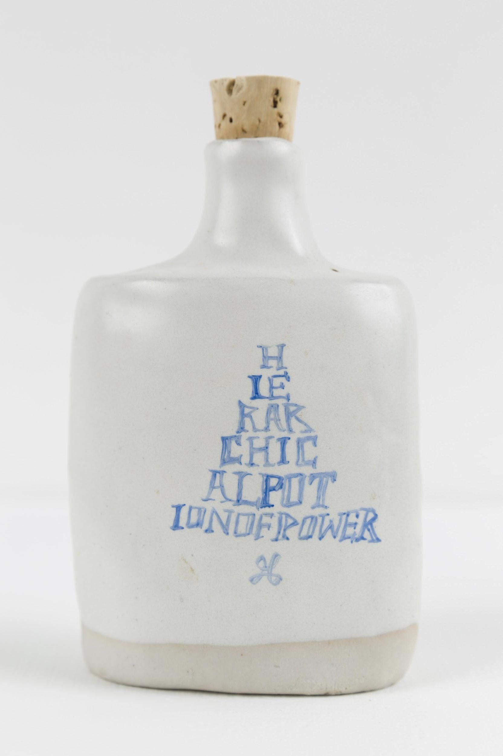 A white bottle with a cork that says ' h is for chic ' on it