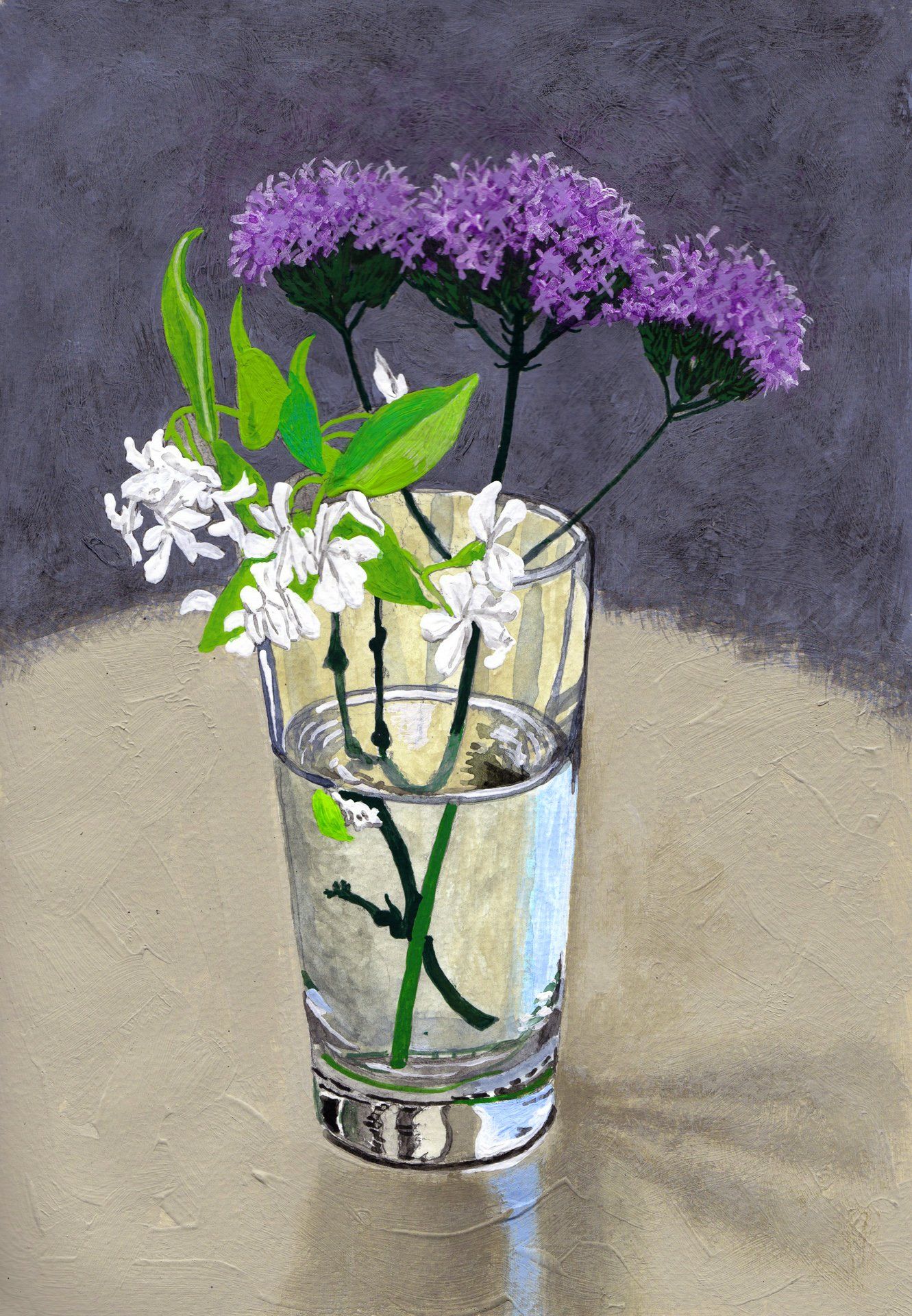 A glass of water with purple and white flowers in it