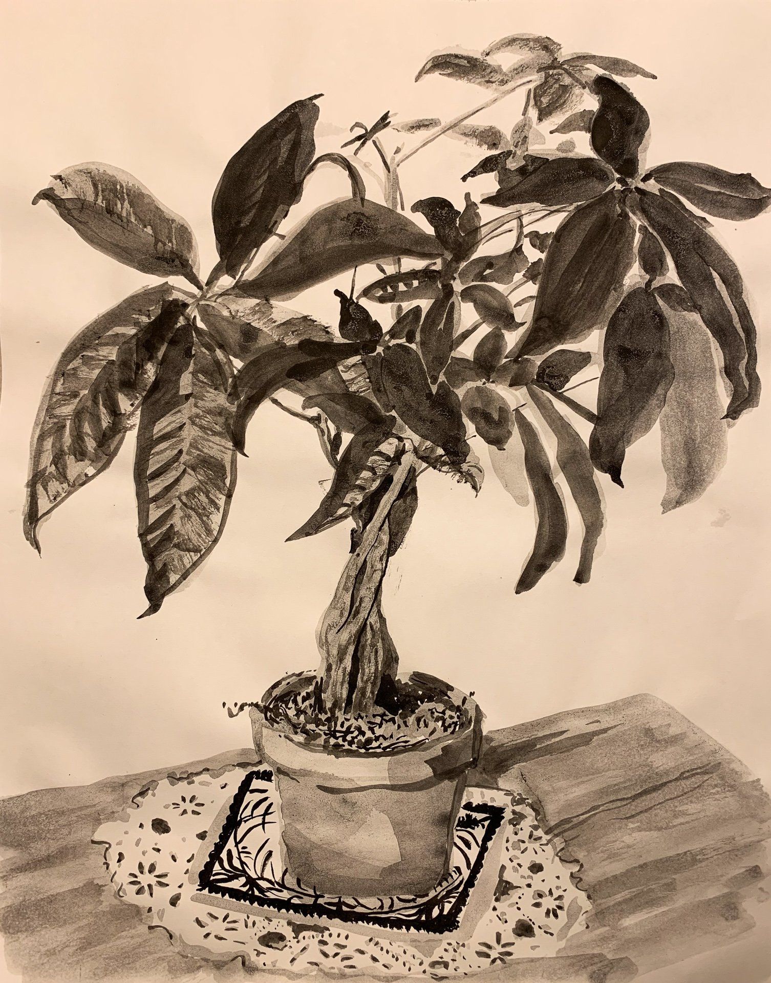A black and white drawing of a potted plant on a table