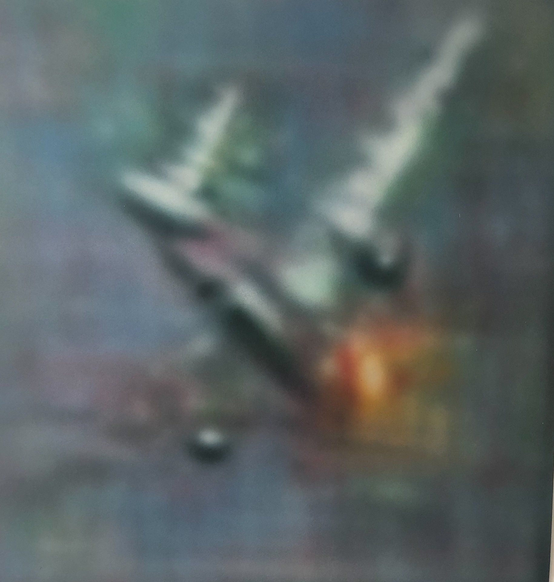 A blurry picture of a plane flying through the air.