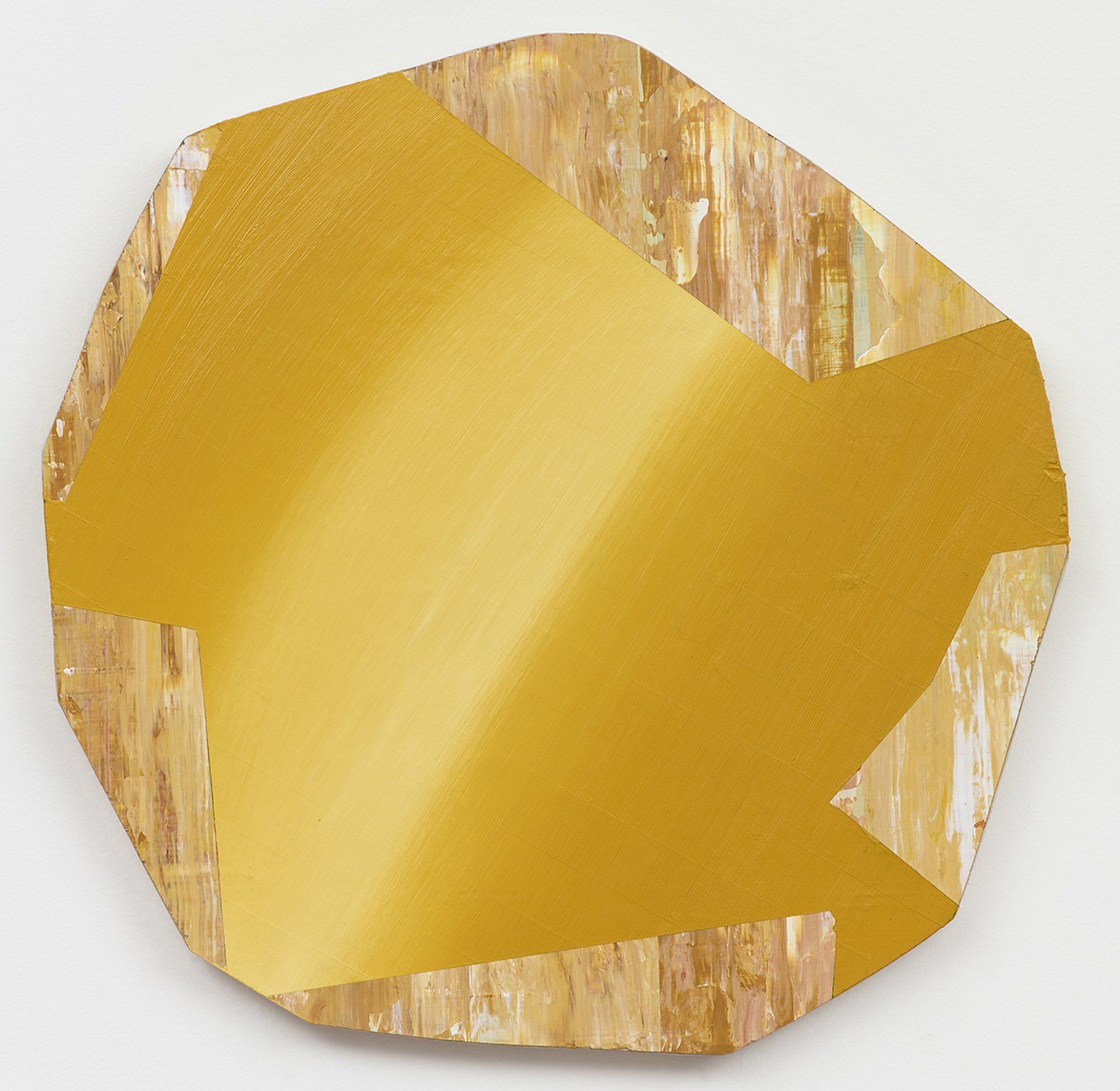 A piece of gold paper that looks like a diamond