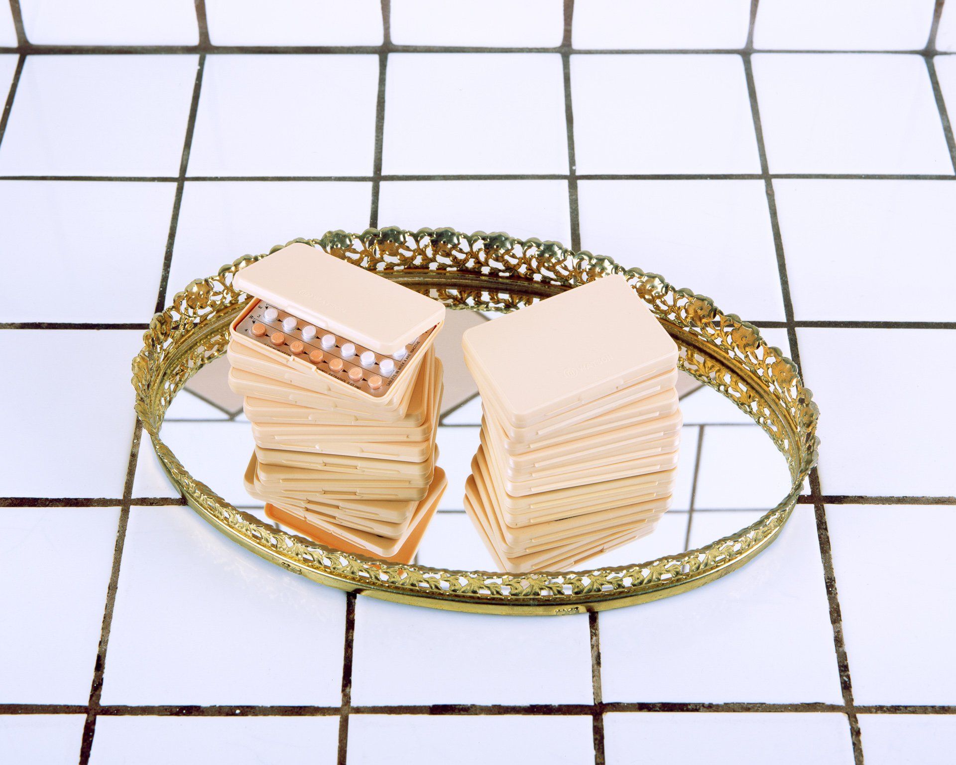 A tray with a stack of pills on it
