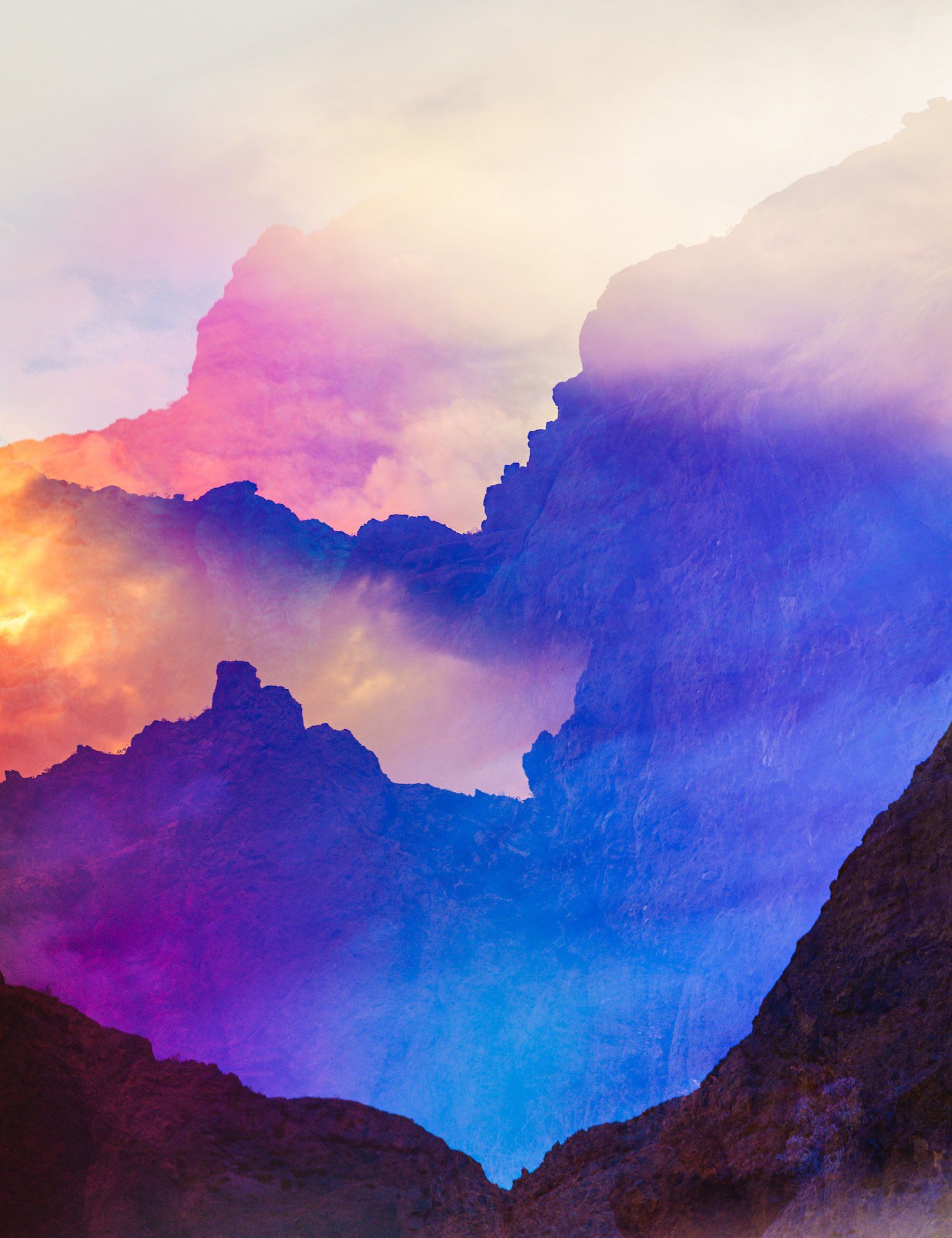 A painting of a mountain range with a sunset in the background