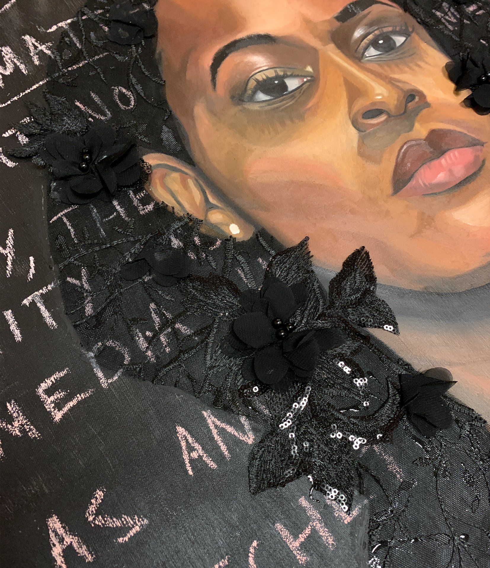 A close up of a painting of a woman 's face