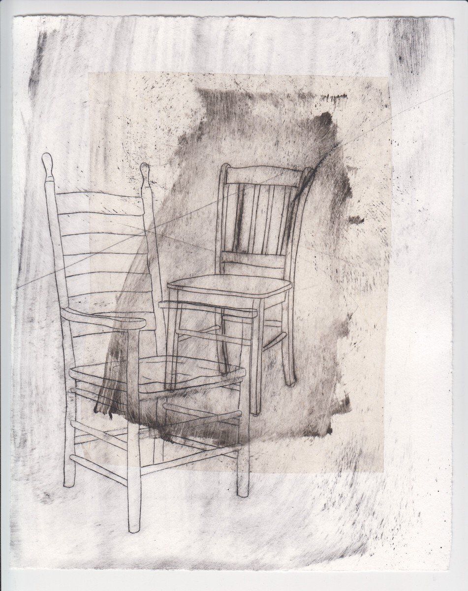 A drawing of two chairs on a piece of paper