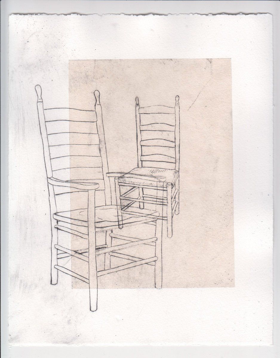 A drawing of two chairs on a piece of paper