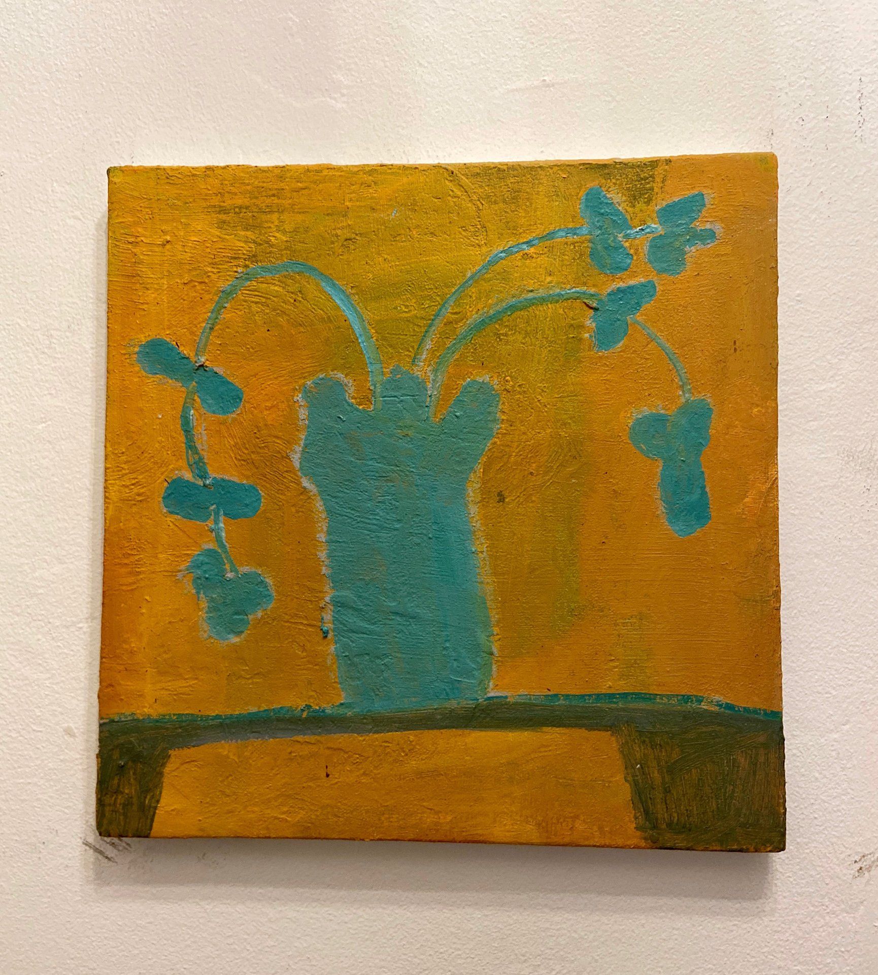 A painting of a blue vase with flowers on a yellow background