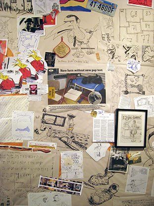 A bulletin board with drawings and a license plate that says 41 46800f