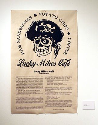 A poster for lucky mike 's cafe with a pirate skull on it