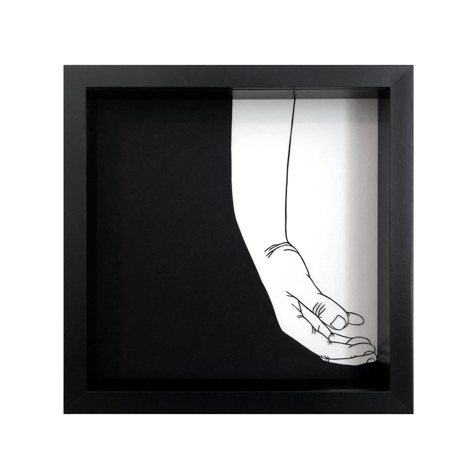 A black and white drawing of a hand in a black frame