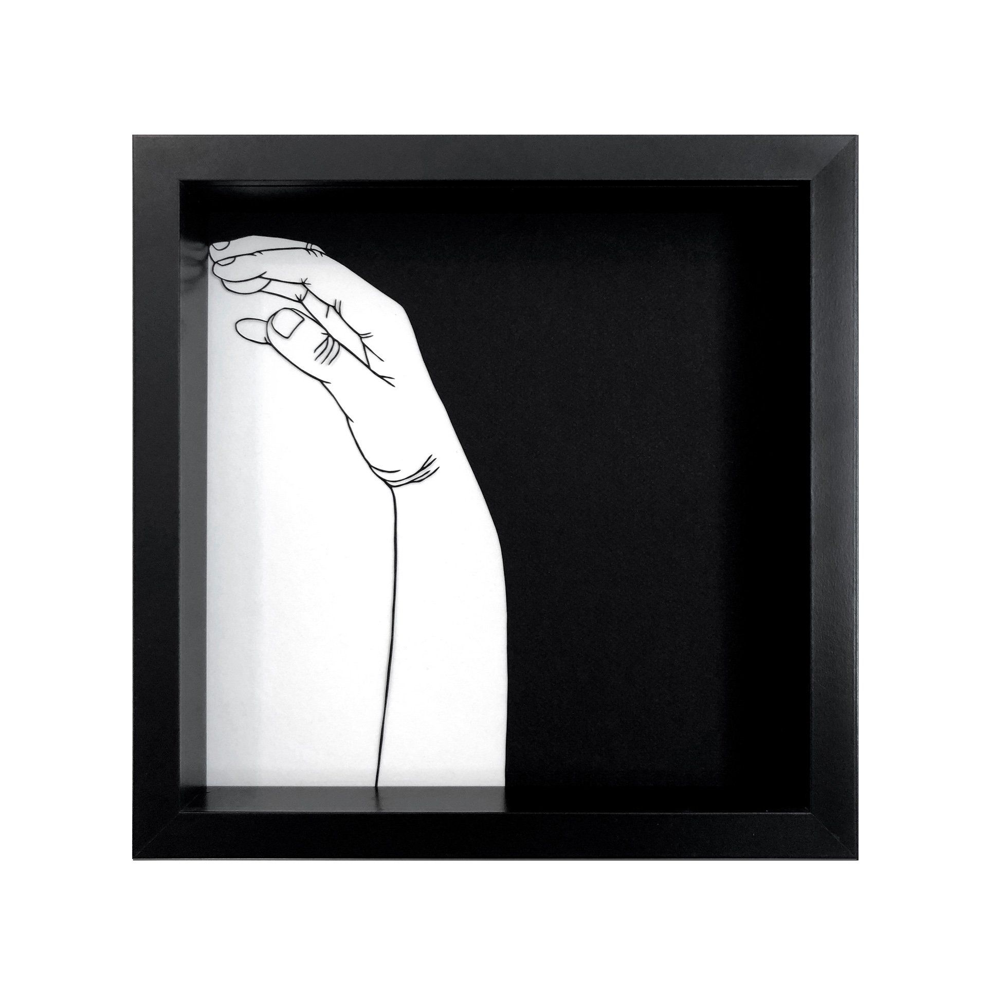 A black and white drawing of a hand in a black frame