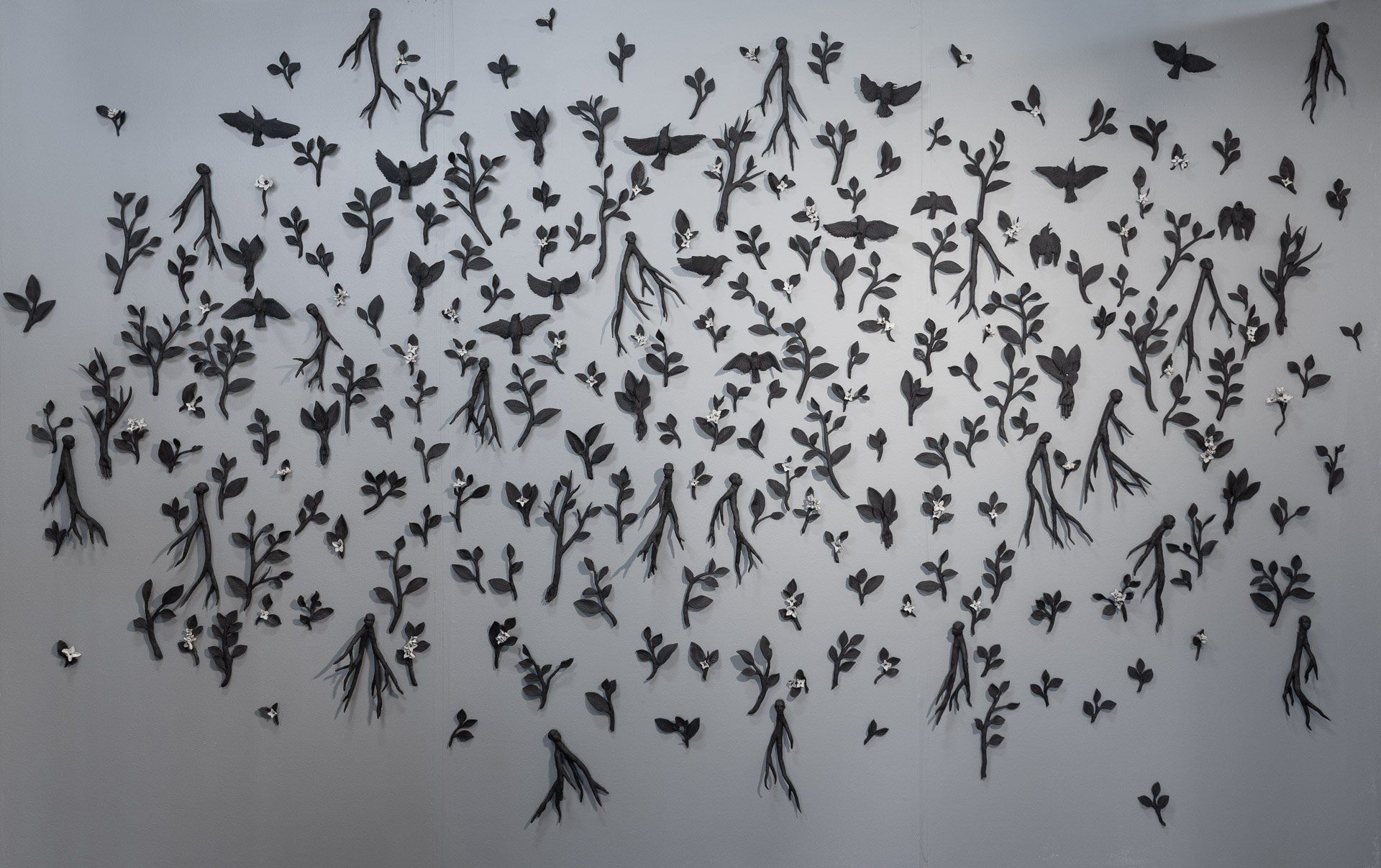 A painting of a flock of birds on a wall