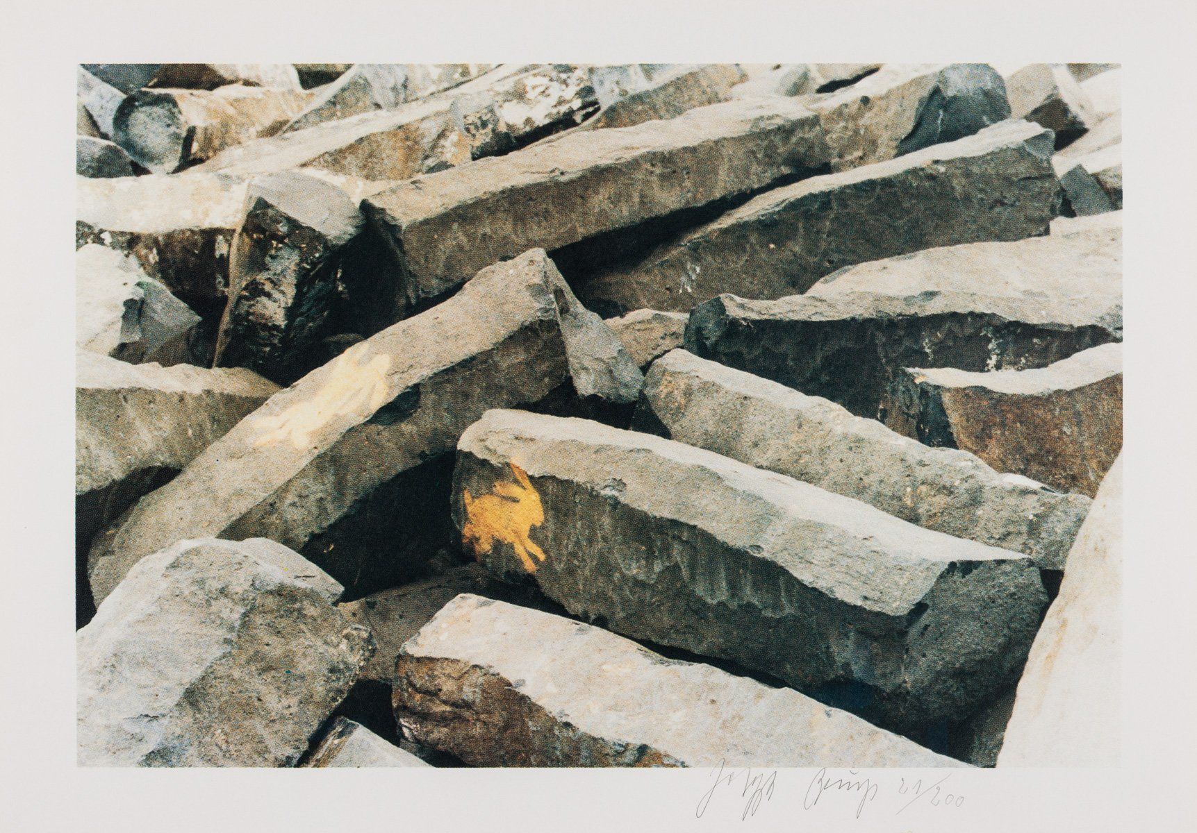A pile of rocks with a yellow object in the middle