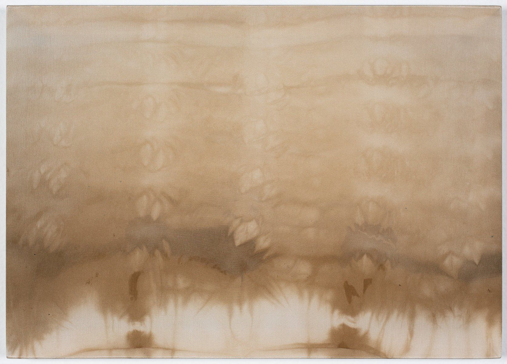 A close up of a piece of brown paper on a white surface.