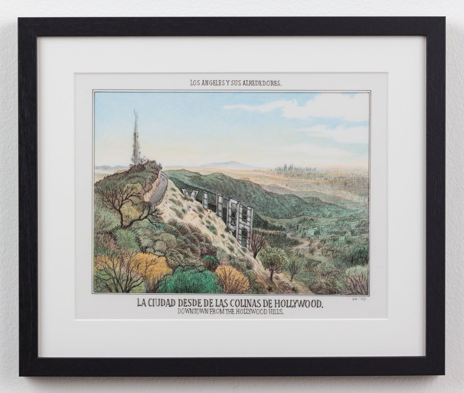 A framed picture of a mountain with the word hollywood on it