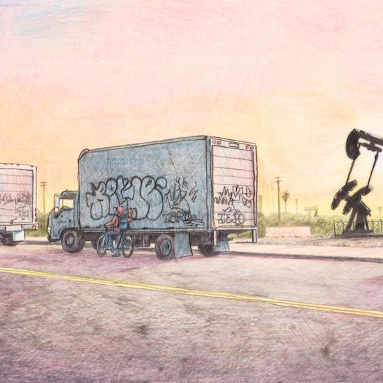 A truck with graffiti on the back is driving down a road next to an oil pump.