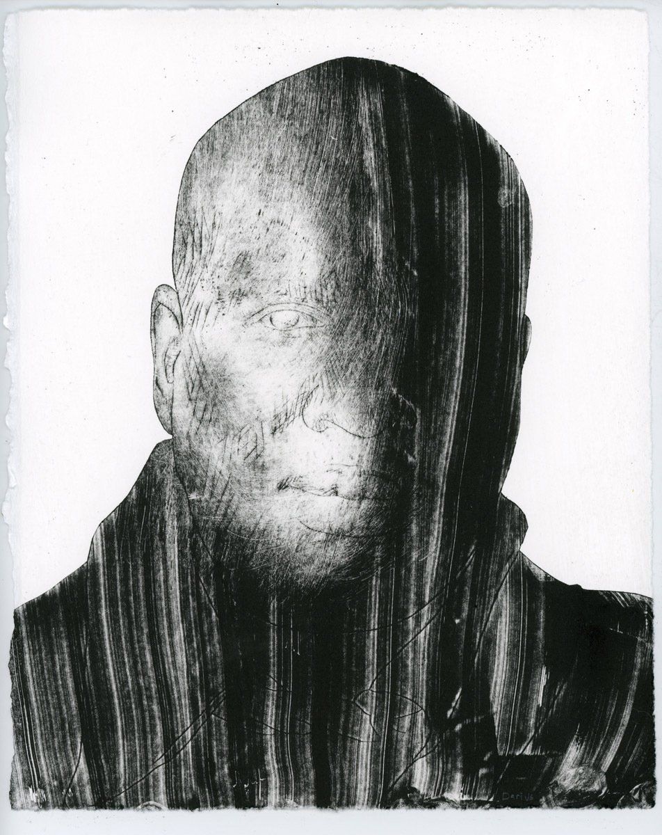 A black and white photo of a man 's face