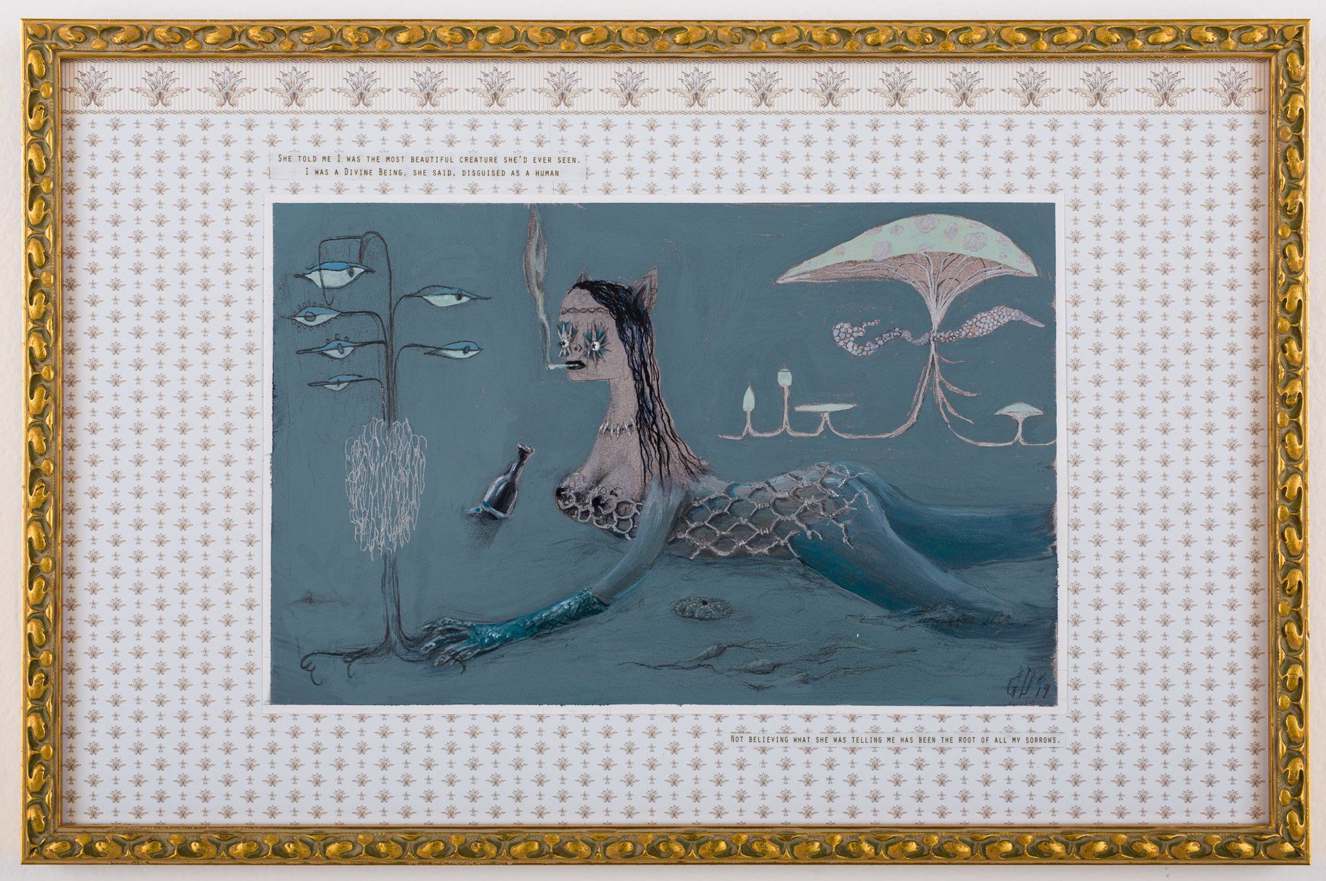 A painting of a mermaid in a gold frame on a wall.