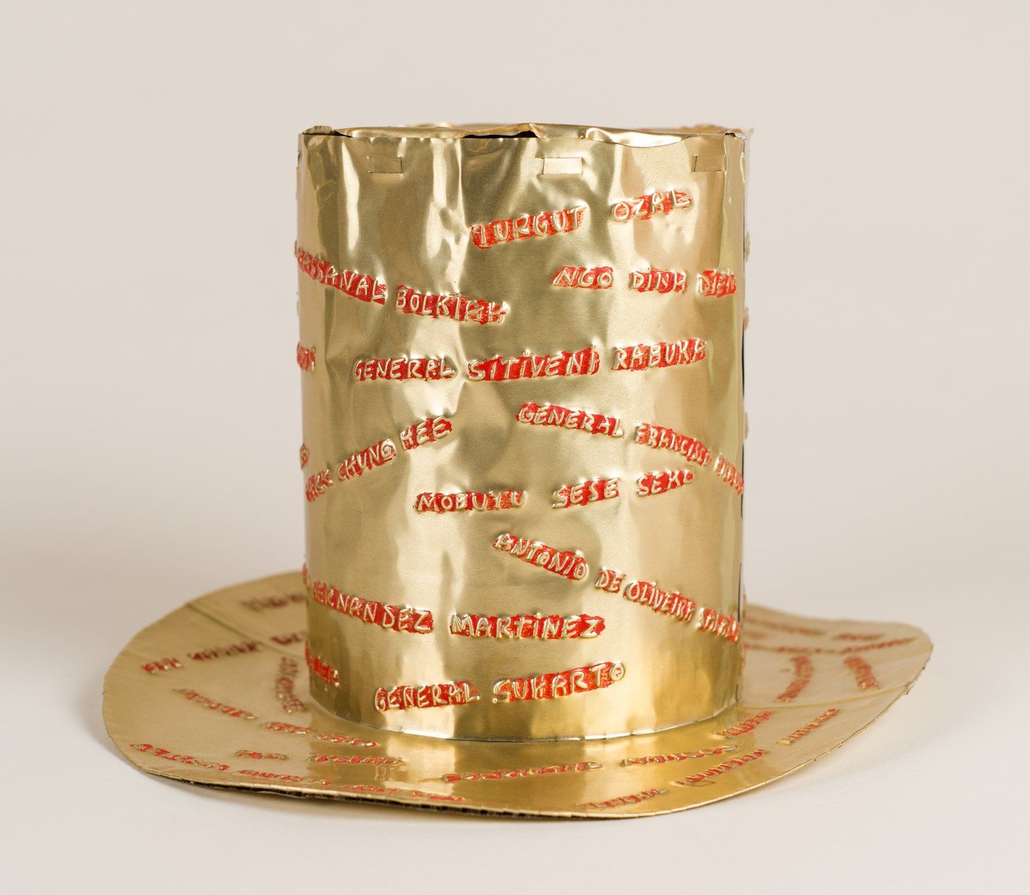 A gold top hat made out of aluminum foil