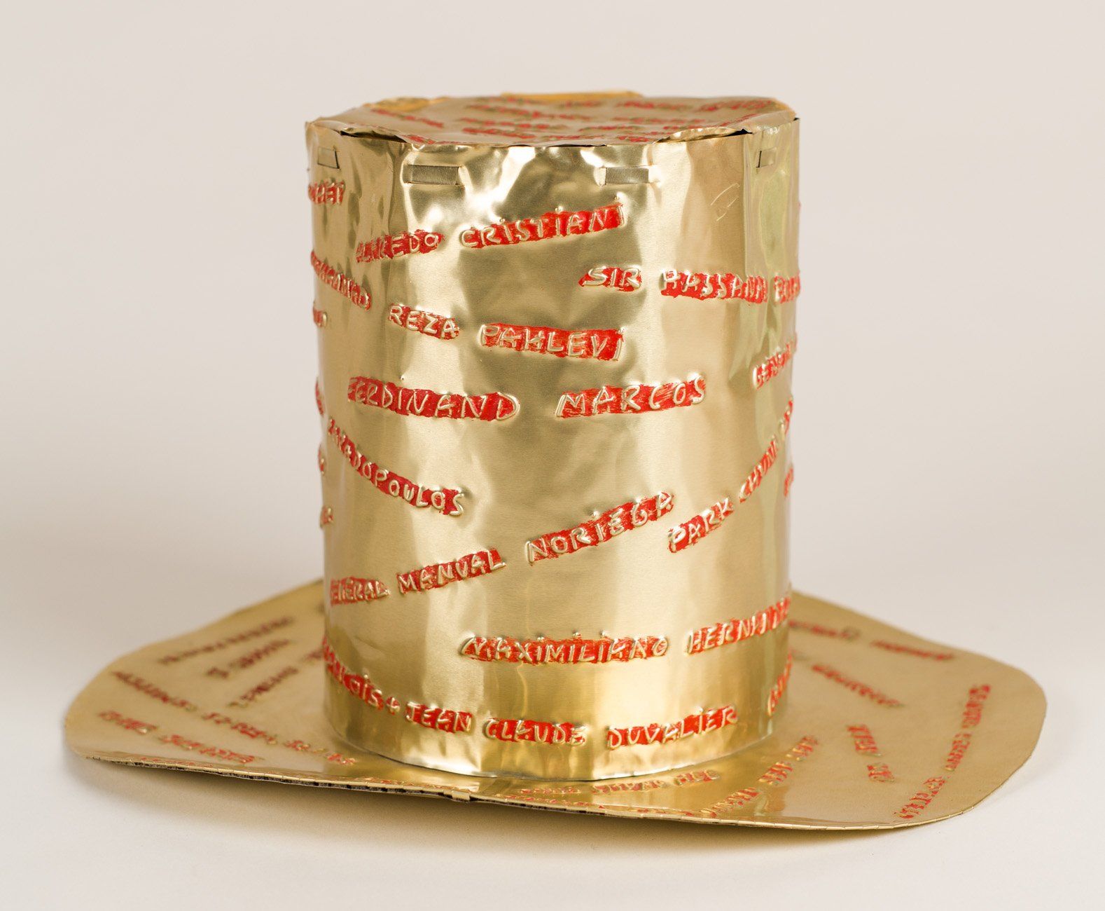 A gold top hat made out of aluminum foil