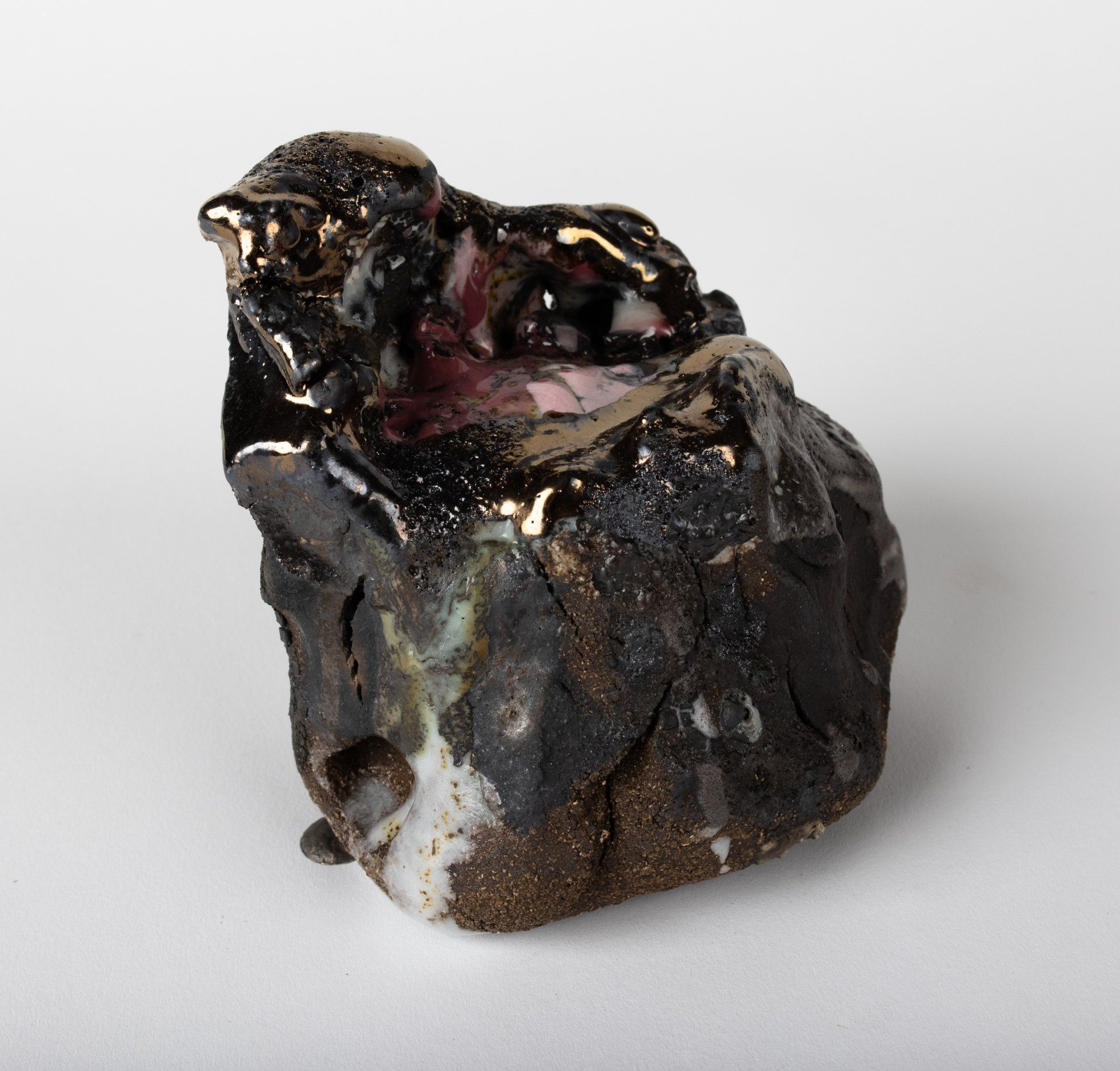 A black and white rock with a hole in the middle