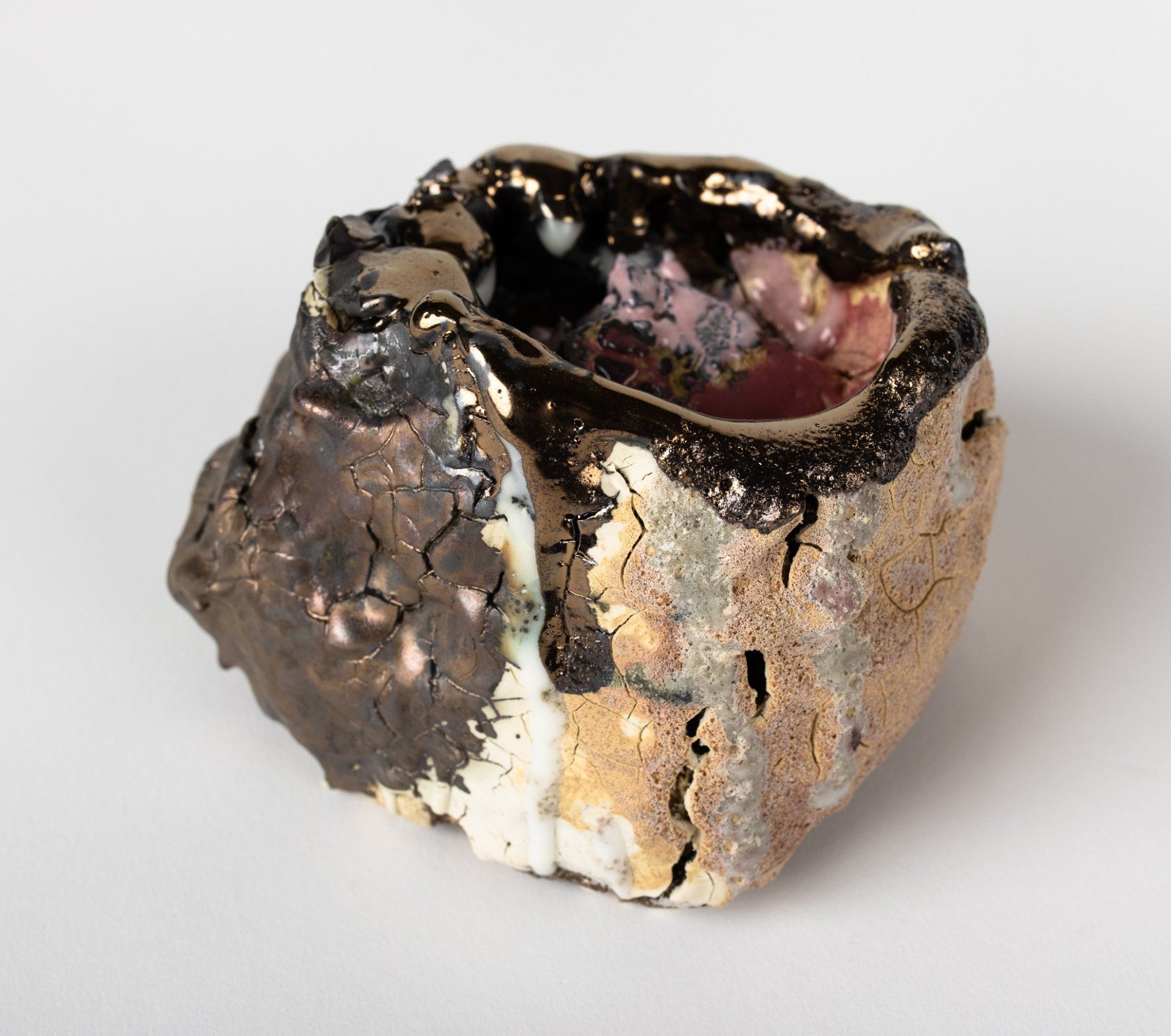 A close up of a rock on a white surface