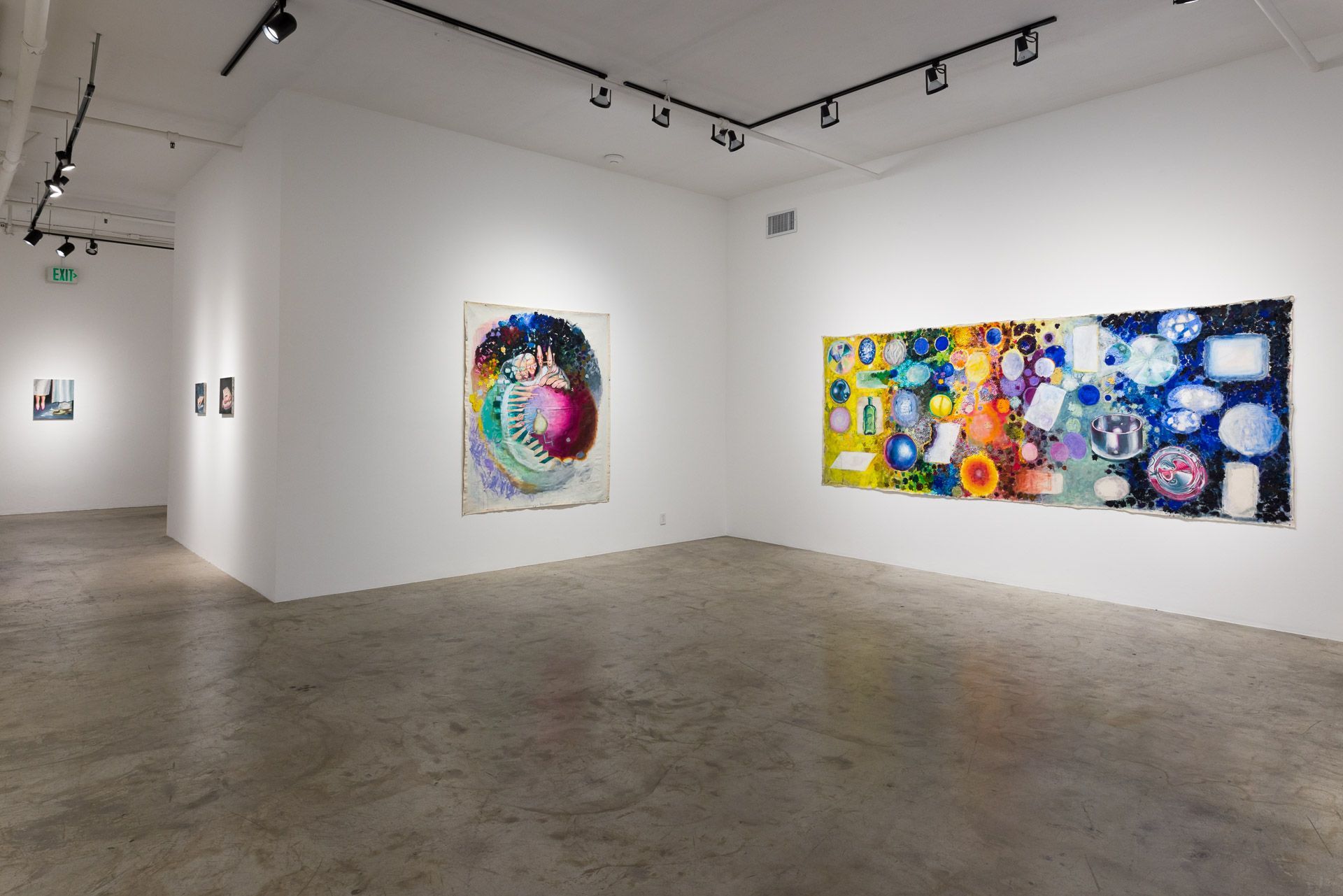 A large room with a lot of paintings on the wall.