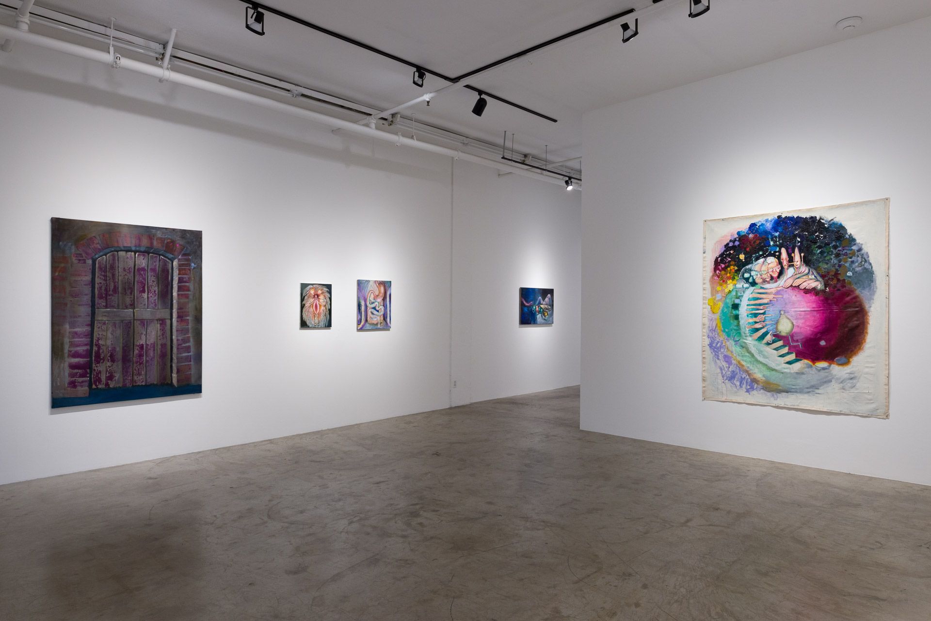 There are many paintings on the wall in this room.
