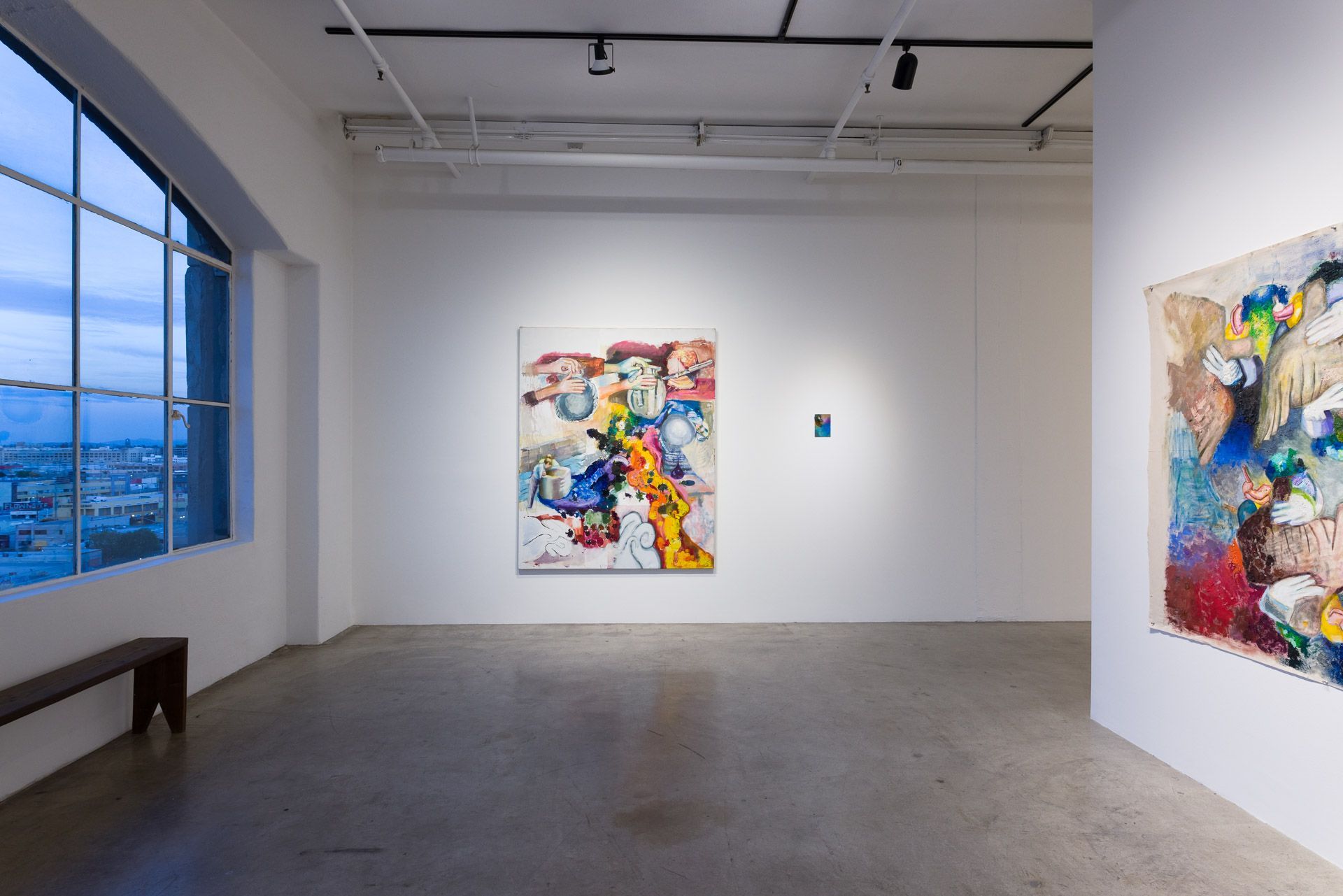 A large room with a lot of paintings on the wall.