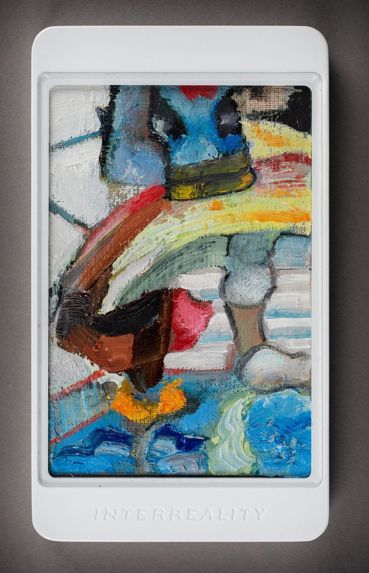 A colorful painting is displayed on a tablet.