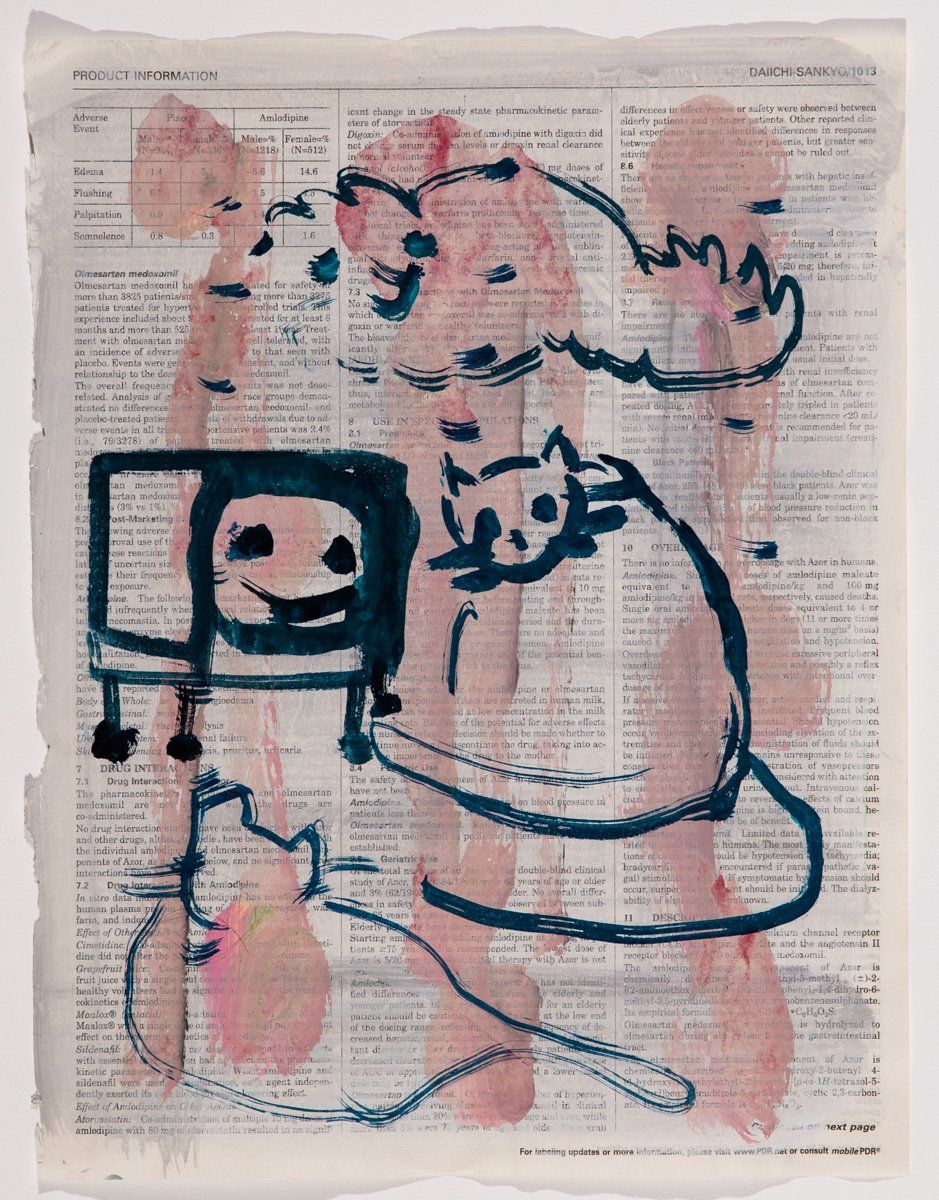 A drawing of a cat and a tv on a piece of paper