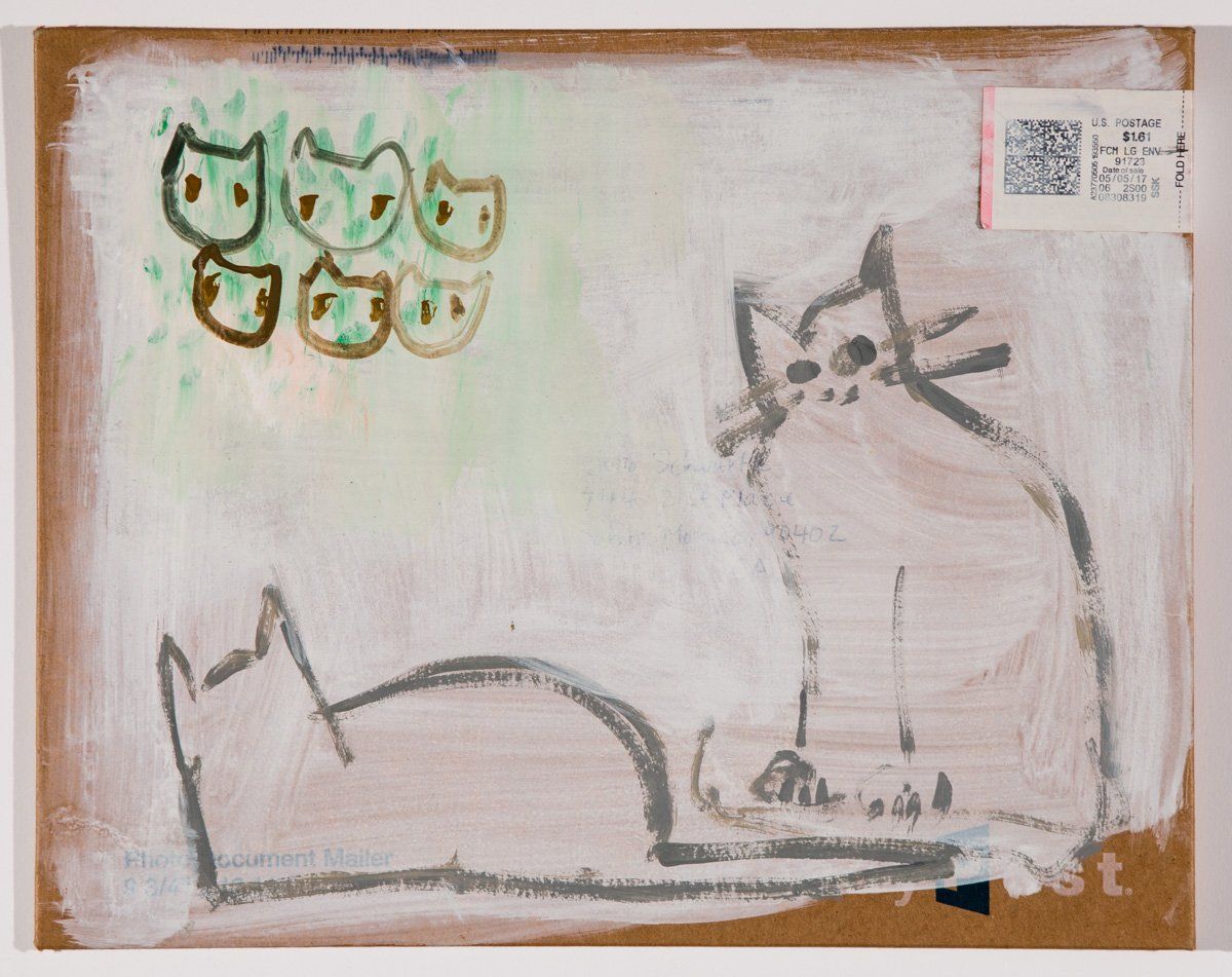 A drawing of a cat on a piece of paper