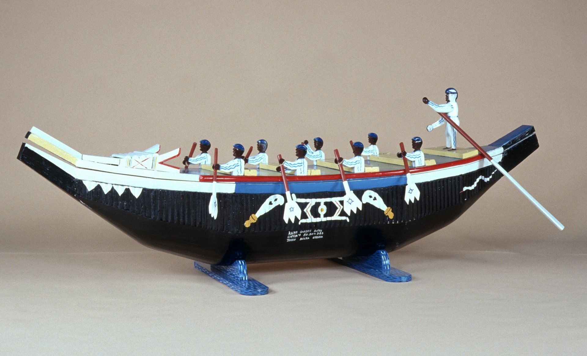 A model of a boat with a man rowing it