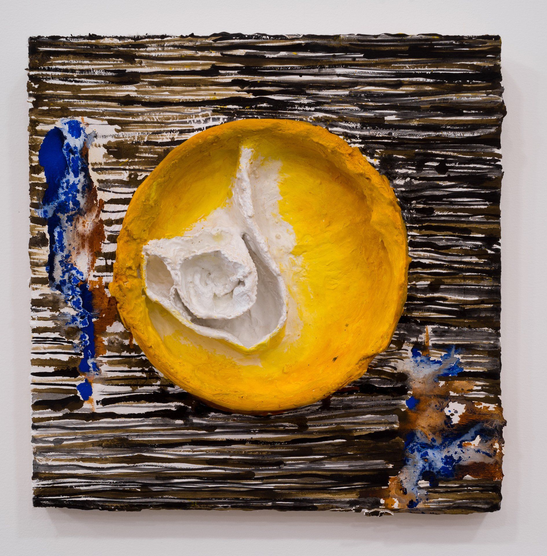 A painting of a yellow circle with a white object in it